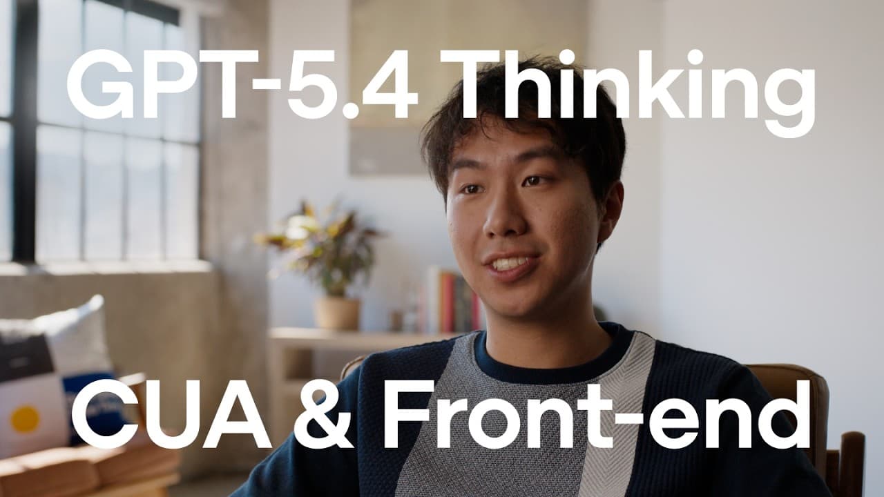 Man sitting in a chair, demonstrating AI capabilities on a laptop.