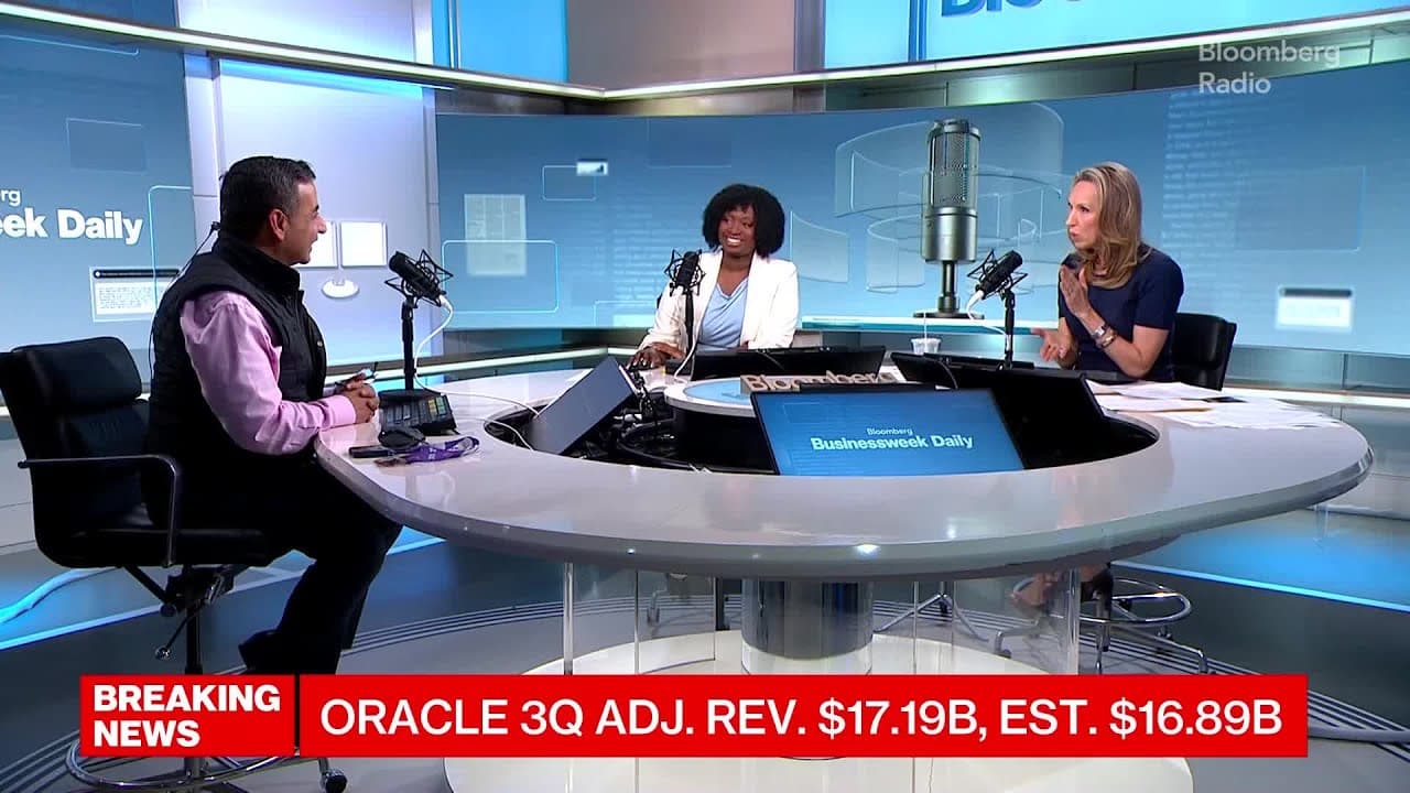 Anurag Rana speaking on a panel with two women at a Bloomberg Radio desk.