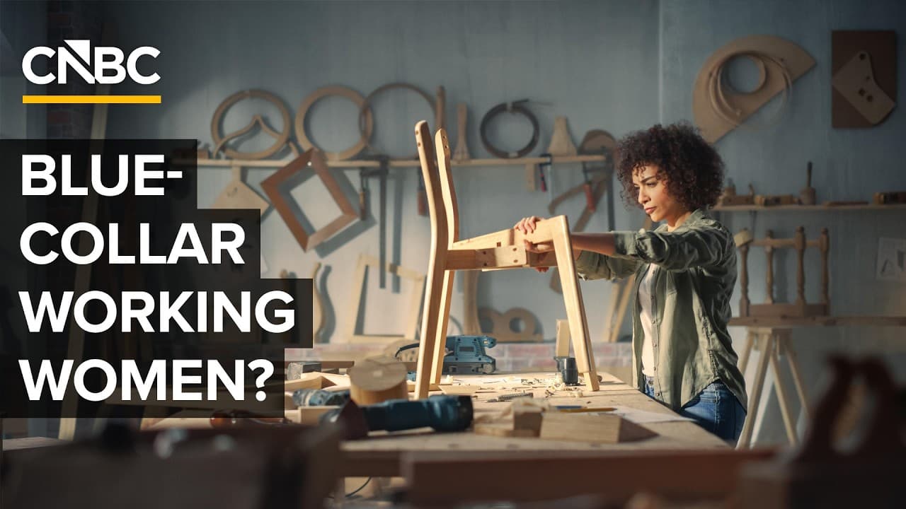 Woman in a hard hat operating an excavator.